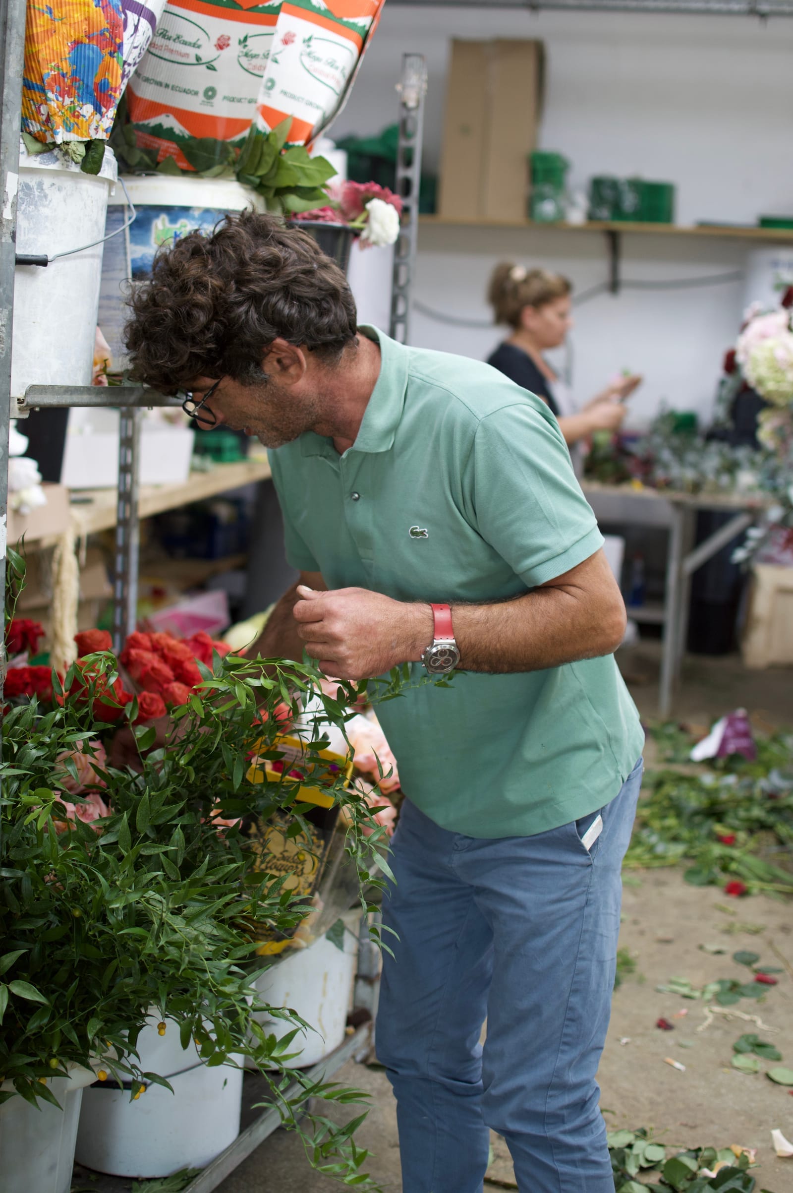 Arranging fresh flowers in the manfler wedding florist workshop near Rethymno, Crete