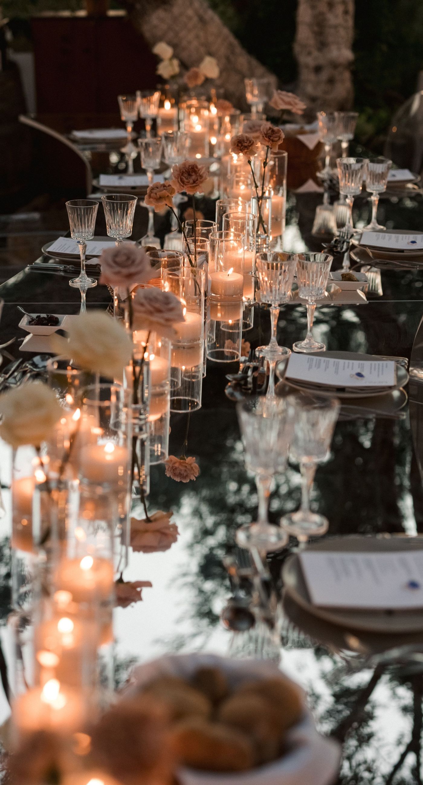  Sasha & Alex - Amidst a breathtaking landscape, this exquisite showcase captures the essence of romance and elegance. Soft hues of blush and ivory blend seamlessly with lush greenery, creating an ethereal garden-like setting. The mirrored aisle reflects the joyful union, adding a touch of glamor to the scene. Delicate florals, thoughtfully arranged, frame the moment, enhancing the dreamy, sophisticated atmosphere. This outdoor celebration perfectly balances natural beauty with refined artistry, embodying the timeless allure of love in a serene, picturesque locale. - Photo 7