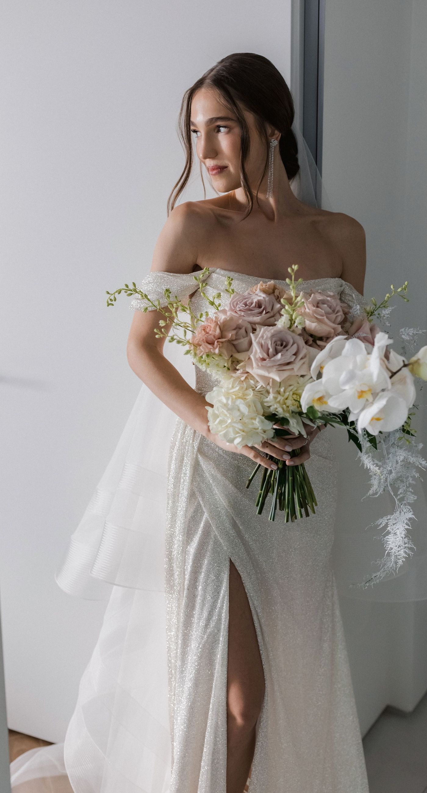  Sasha & Alex - Amidst a breathtaking landscape, this exquisite showcase captures the essence of romance and elegance. Soft hues of blush and ivory blend seamlessly with lush greenery, creating an ethereal garden-like setting. The mirrored aisle reflects the joyful union, adding a touch of glamor to the scene. Delicate florals, thoughtfully arranged, frame the moment, enhancing the dreamy, sophisticated atmosphere. This outdoor celebration perfectly balances natural beauty with refined artistry, embodying the timeless allure of love in a serene, picturesque locale. - Photo 2