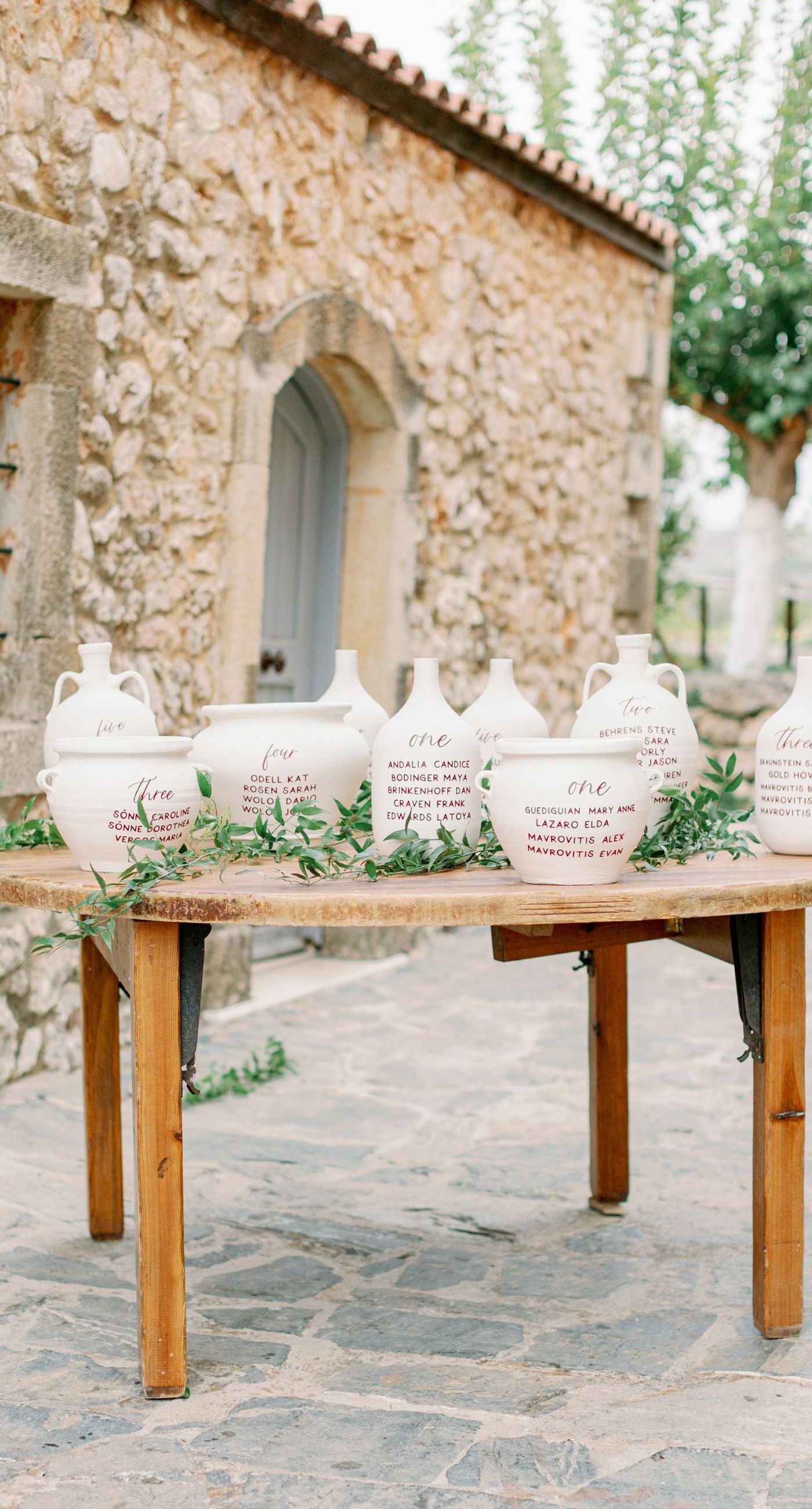 Chiara & Marco - In an elegant dance of romance and subtlety, a couple is enveloped in a moment of intimate anticipation. Their surroundings whisper of nature's abundance, while the soft, muted colors of the bouquet enhance the gentle harmony between the blue suit and white gown. The florist's artistry is evident in the meticulous arrangement of delicate blooms and verdant leaves, highlighting the signature flair for understated sophistication. This serene union of floral grace and human connection brings forth an aesthetic that is both timeless and heartwarming, ideal for a setting that celebrates love and nature in its simplest form. - Photo 5