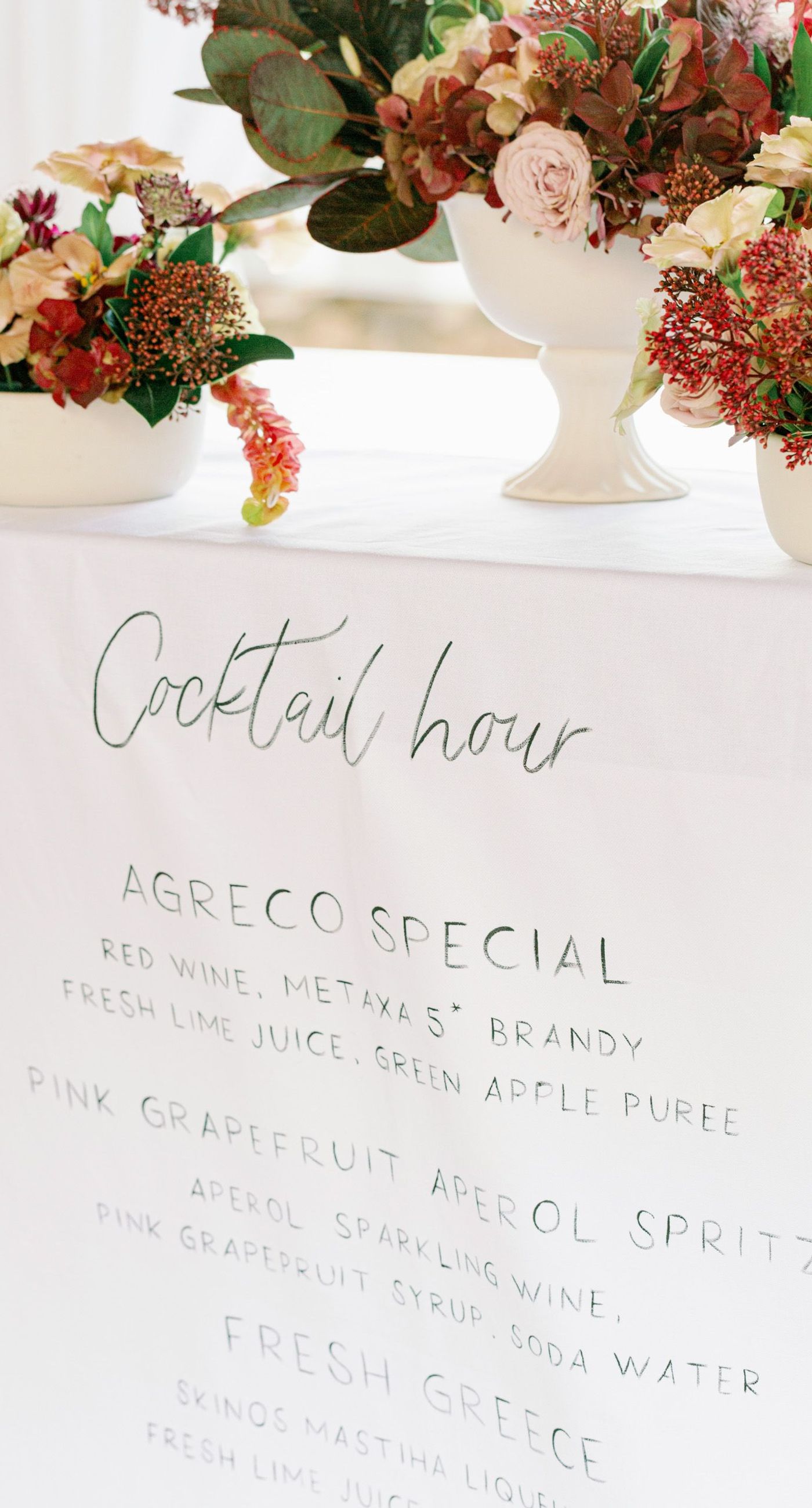 Chiara & Marco - In an elegant dance of romance and subtlety, a couple is enveloped in a moment of intimate anticipation. Their surroundings whisper of nature's abundance, while the soft, muted colors of the bouquet enhance the gentle harmony between the blue suit and white gown. The florist's artistry is evident in the meticulous arrangement of delicate blooms and verdant leaves, highlighting the signature flair for understated sophistication. This serene union of floral grace and human connection brings forth an aesthetic that is both timeless and heartwarming, ideal for a setting that celebrates love and nature in its simplest form. - Photo 9