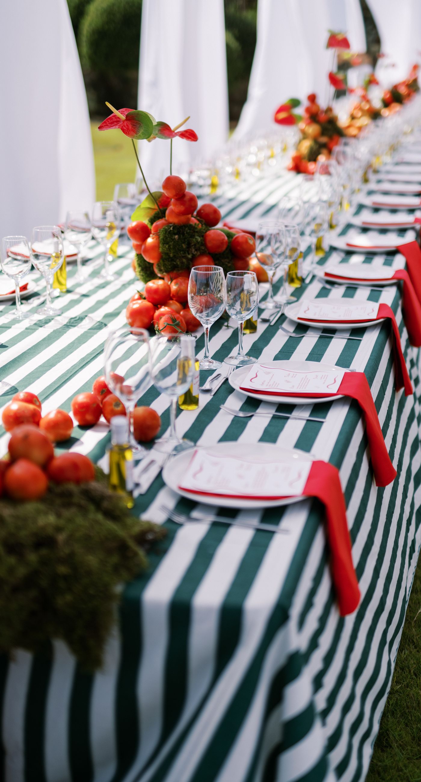 Garden Ceremony - A complete wedding experience designed with a focus on color, flow, and a strong sense of place. The ceremony is framed by vibrant florals in warm tones, creating a natural and expressive setting for the couple. The dinner that follows is defined by long tables, rhythmic textiles, and unexpected details that introduce a sense of playful elegance. A project that balances structure and ease, designed to feel authentic and experienced without effort. - Photo 19