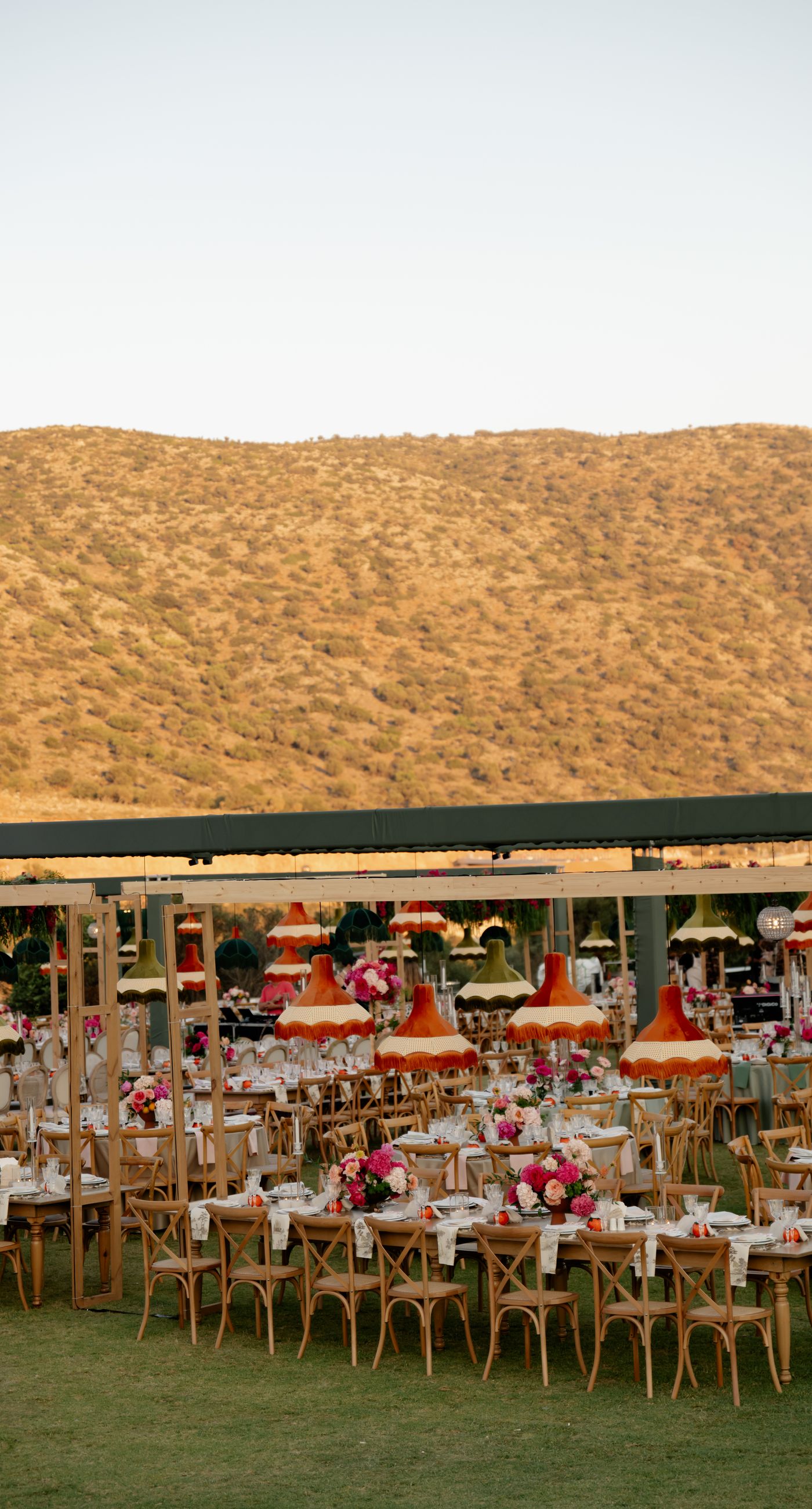 A Sculptural Ceremony in Pink - A modern wedding on the green, with clean lines and soft pink florals subtly standing out against the natural landscape. A setting that feels minimal, bright, and effortlessly elegant. - Photo 15