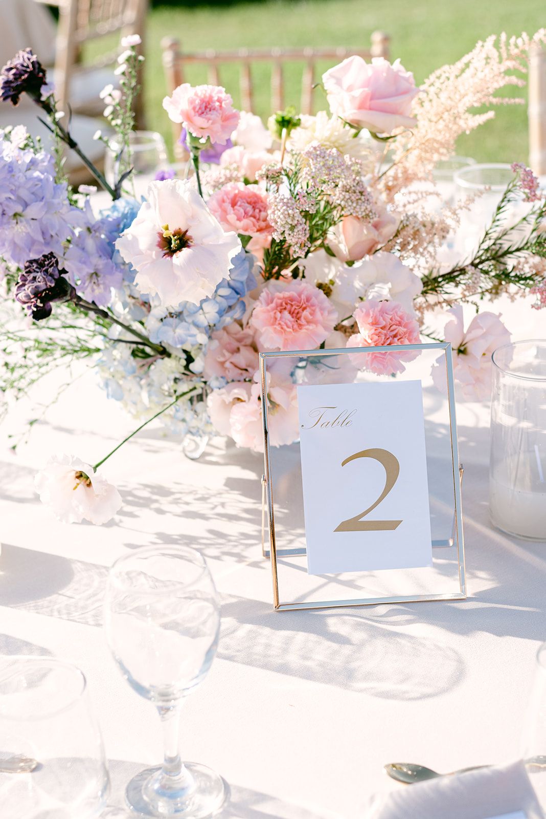 Georges&Marianna - In this exquisite composition, the scene is set with a timeless elegance, captured in a moment of pure joy and connection. The bride's sumptuous white gown cascades gracefully, its off-shoulder design complementing her delicate headpiece, which glimmers subtly under the soft lighting. She is juxtaposed beautifully against the groom's classic black tuxedo, a marriage of sophistication and contemporary flair. The grand marble staircase in the background adds an air of opulence, harmonizing with the earth tones of the venue's refined architecture. Their expressions of happiness, framed by muted hues and elegant lines, evoke an atmosphere of romance and understated luxury, perfect for a portfolio that celebrates life's most beautiful occasions. - Photo 9