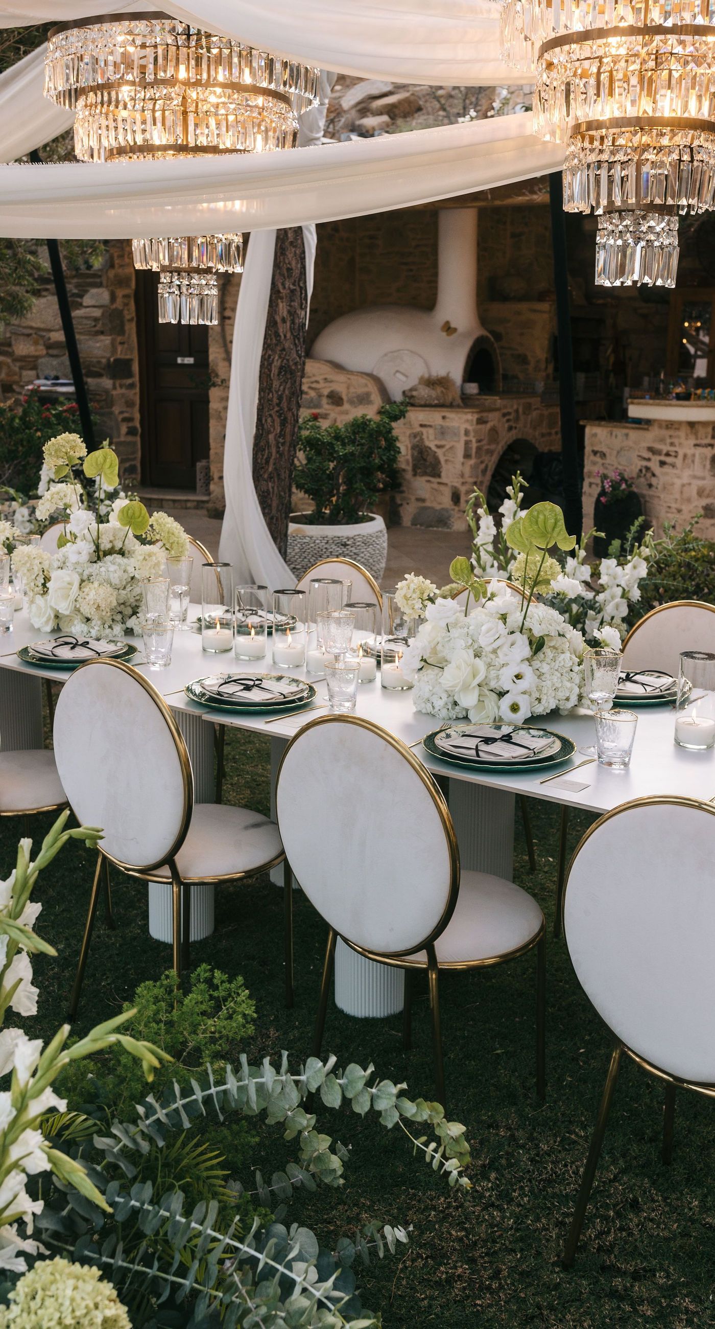 Kala & Kerwin - Bathed in the warm glow of a setting sun, the bouquet of creamy white blooms and eucalyptus whispers elegance and romance. It complements the ethereal lace details of the attire, creating a harmonious blend of textures and colors. The backdrop of rustic stone steps hints at a location where nature and romance intertwine seamlessly, offering a timeless, serene beauty. This work encapsulates a moment of profound connection and grace, emphasizing the pure emotional essence captured on a special day. - Photo 13