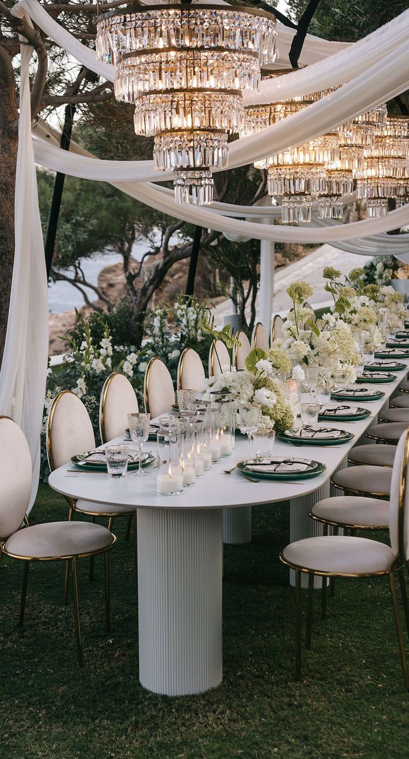 Kala & Kerwin - Bathed in the warm glow of a setting sun, the bouquet of creamy white blooms and eucalyptus whispers elegance and romance. It complements the ethereal lace details of the attire, creating a harmonious blend of textures and colors. The backdrop of rustic stone steps hints at a location where nature and romance intertwine seamlessly, offering a timeless, serene beauty. This work encapsulates a moment of profound connection and grace, emphasizing the pure emotional essence captured on a special day. - Photo 4