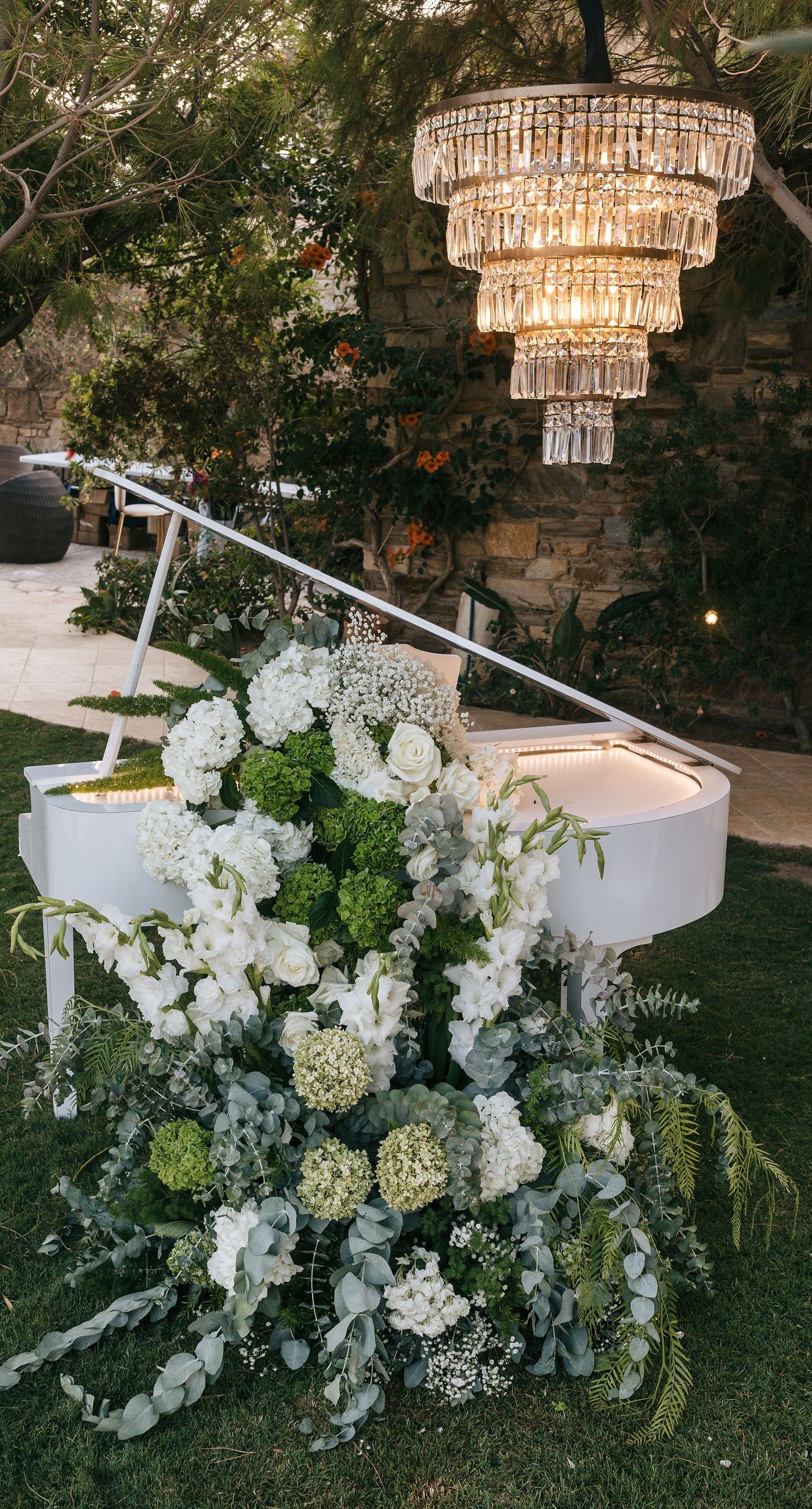 Kala & Kerwin - Bathed in the warm glow of a setting sun, the bouquet of creamy white blooms and eucalyptus whispers elegance and romance. It complements the ethereal lace details of the attire, creating a harmonious blend of textures and colors. The backdrop of rustic stone steps hints at a location where nature and romance intertwine seamlessly, offering a timeless, serene beauty. This work encapsulates a moment of profound connection and grace, emphasizing the pure emotional essence captured on a special day. - Photo 14