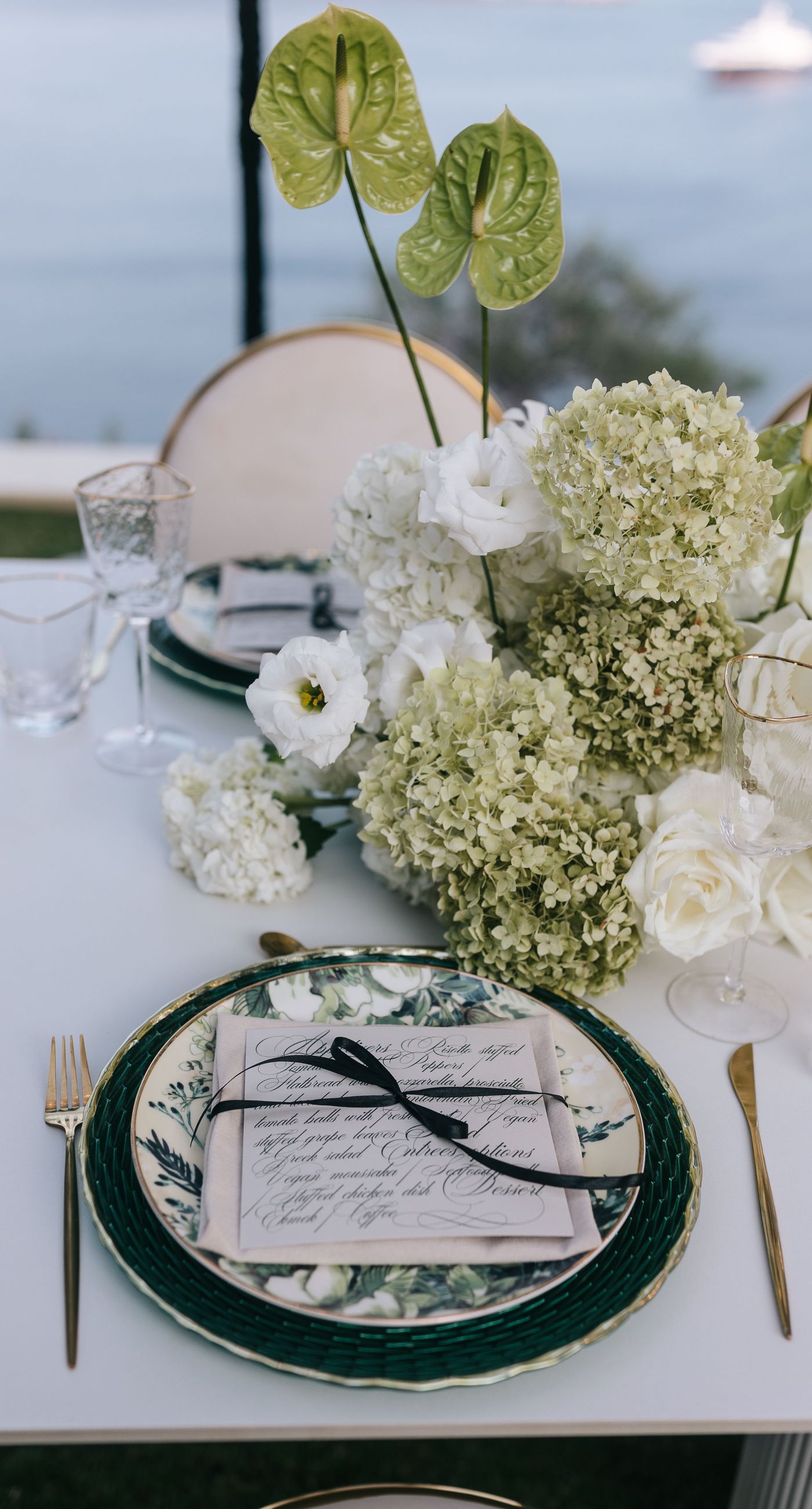 Kala & Kerwin - Bathed in the warm glow of a setting sun, the bouquet of creamy white blooms and eucalyptus whispers elegance and romance. It complements the ethereal lace details of the attire, creating a harmonious blend of textures and colors. The backdrop of rustic stone steps hints at a location where nature and romance intertwine seamlessly, offering a timeless, serene beauty. This work encapsulates a moment of profound connection and grace, emphasizing the pure emotional essence captured on a special day. - Photo 10