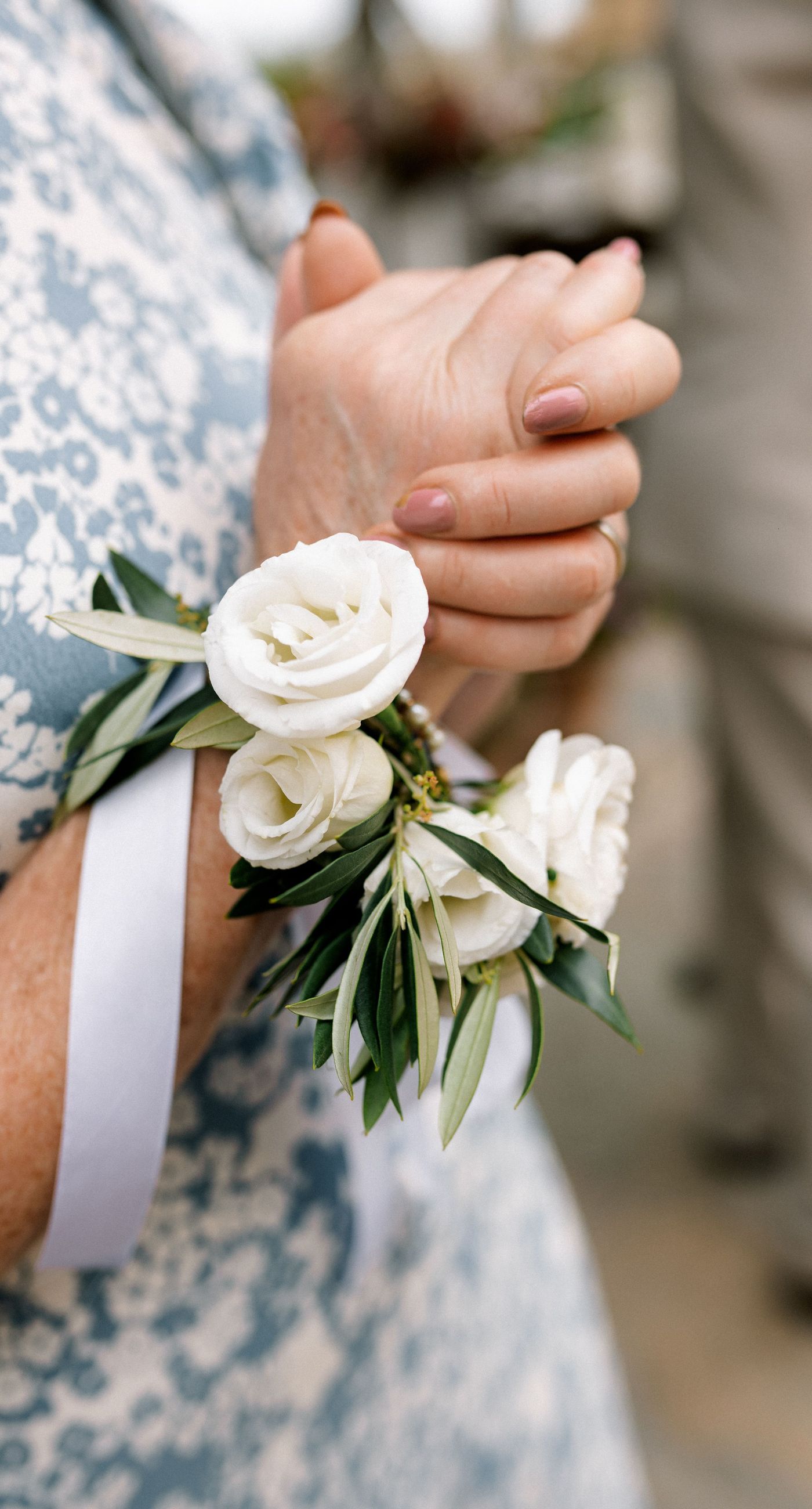 Katherine & Adam - Nestled within the lush, sprawling rows of a vineyard, the scene captures an exquisite moment of romance and elegance. The verdant landscape creates a serene backdrop, perfectly complementing the delicate whites and soft greens of the bride's bouquet. The interplay between the timeless black tuxedo and the pure white gown establishes a harmonious balance, inviting you into a world of classic beauty and serene intimacy. The gentle kiss shared amidst the verdant vines evokes a sense of rustic charm blended with refined grace, an ideal setting for a florist's artistry in capturing life's tender moments. - Photo 7