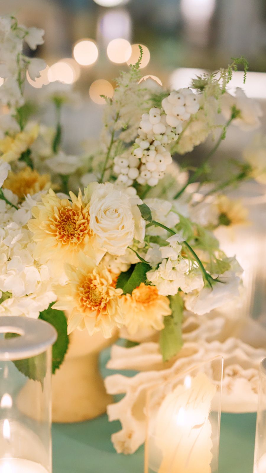 Maria & George  - In this captivating scene, the essence of love and nature come together harmoniously, as the gentle sunlight filters through the trees, casting a warm and inviting glow. A bouquet bursts with life, showcasing a rich tapestry of soft ivory and blush roses, complemented by delicate greenery. The elegant arrangement, full of texture and subtle vibrancy, perfectly captures the serene ambiance of this outdoor setting. Every element speaks of artistry and romance, making it a quintessential addition to a florist's portfolio, where nature's beauty and human emotion intertwine seamlessly. - Photo 10