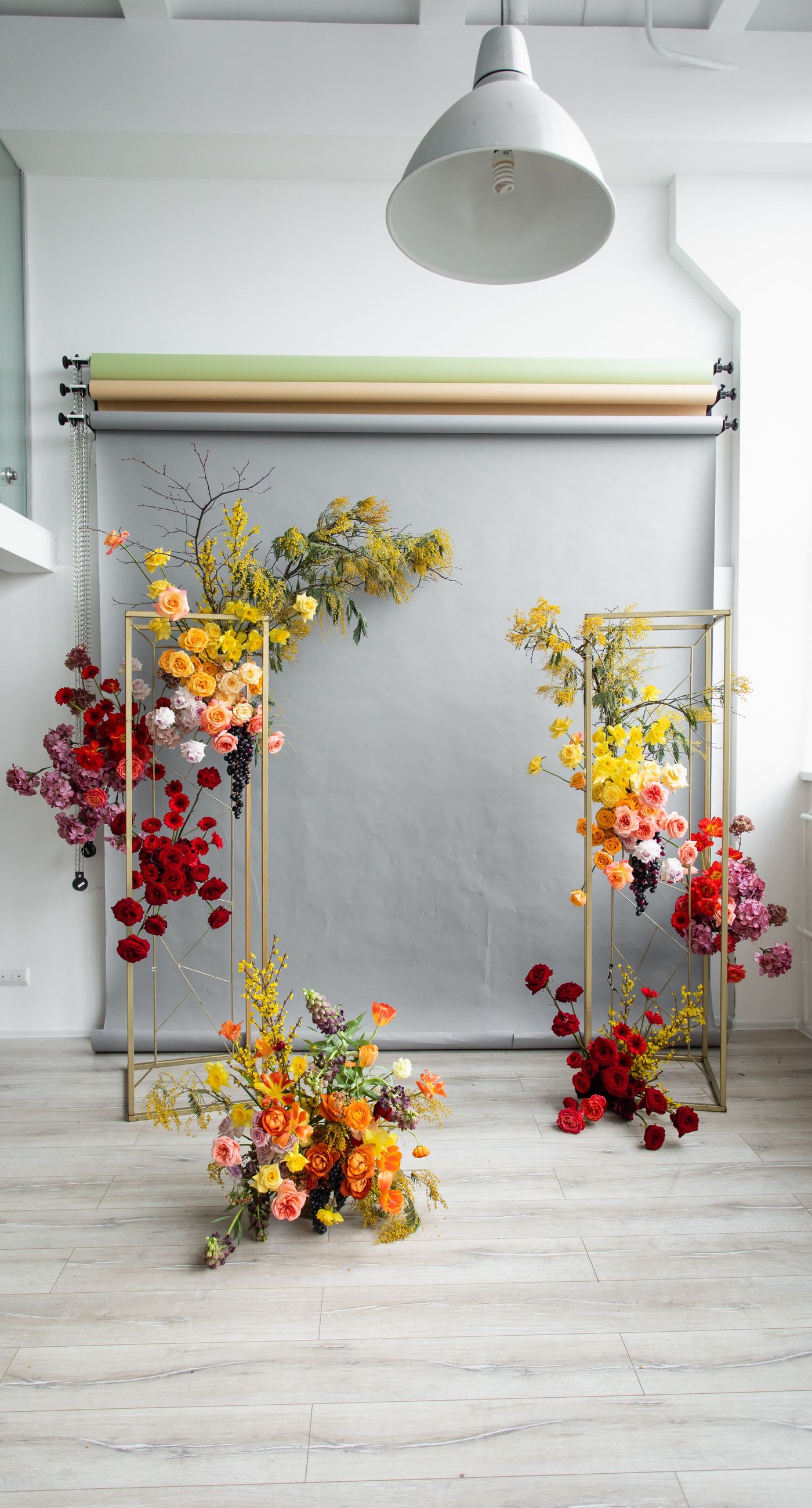 Medieval Dinner - In a symphony of colors, this floral arrangement weaves together vibrancy and elegance, creating an aesthetic that feels both timeless and contemporary. The vivid reds, yellows, and oranges of the blooms contrast strikingly against a soft, neutral backdrop, while a rich, wine-colored robe adds a touch of opulence. Surrounded by a lush abundance of fruits and elegant tableware, the setting evokes a sense of refined abundance, as if captured in a modern-day still life. The arrangement harmoniously balances the natural and the curated, transforming the space into a living work of art, and serving as a striking centerpiece for a florist's creative portfolio.
 - Photo 5