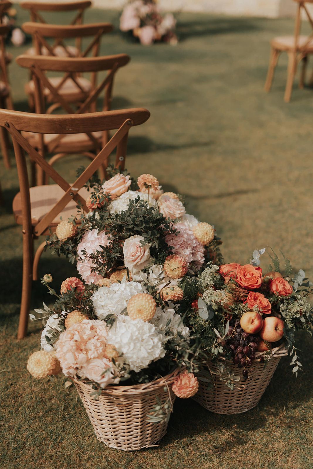Mitchell & Antoinnette - In a moment that captures the essence of serene elegance, a couple stands poised against the backdrop of a distant shoreline. Her flowing white gown, complemented by his classic black tuxedo, exudes timeless sophistication. The gentle cascade of her dark locks adds a soft contrast to the bright purity of her dress, embodying a harmonious balance of light and dark. The subtle embrace and their intertwined fingers speak a silent language of affection, creating an intimate tableau. This tranquil scene, bathed in natural light and framed by the lush greenery beyond, evokes a sense of calm and enduring romance—an ideal accompaniment to any floral arrangement that seeks to encapsulate love in its most genuine form. - Photo 2
