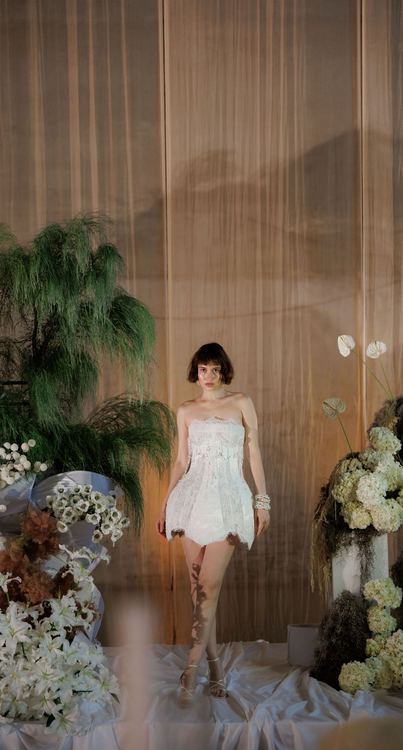 The Extravaganza Flower - Set within an industrial space, this project was conceived as an atmospheric dining experience where light and form take center stage. A sculptural, suspended installation “blooms” above the table, creating depth and scenography, while a candlelit setup adds warmth and intimacy. Clean lines, transparent materials, and subtle florals complete a design that goes beyond decoration it is installation art with emotion. - Photo 1