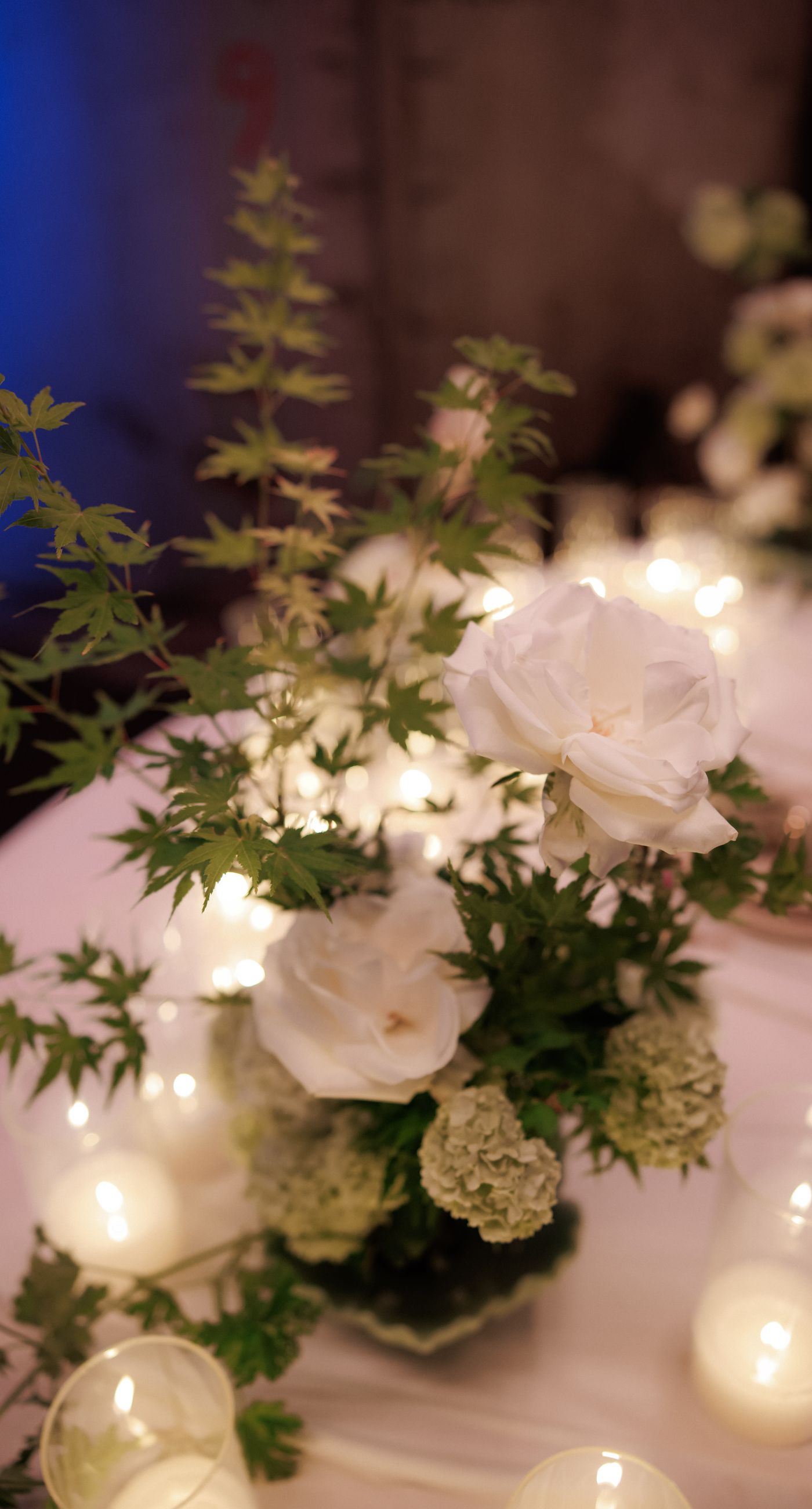 In the Glow - We designed an atmospheric candlelit dining setup that blends modern aesthetics with romantic warmth. Glass candle holders, layered candlelight, and elegant floral arrangements in soft tones create a refined experience for guests, ideal for editorial weddings and contemporary events. A setting that enhances the space and transforms dinner into a memorable moment - Photo 8